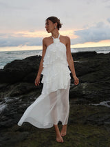 Brunette model wearing the Melissa Halter Maxi Dress in White campaign shot 