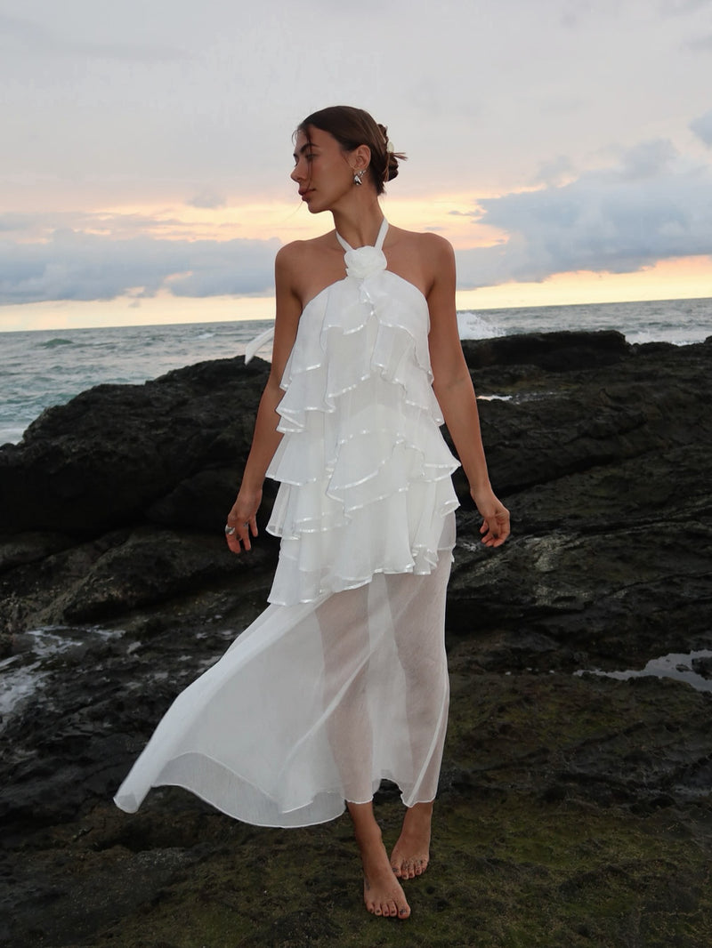 Brunette model wearing the Melissa Halter Maxi Dress in White campaign shot 