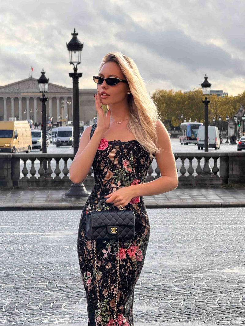 Brunette model wearing the Morgaine Lace Midi Dress in Black campaign shot