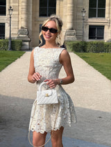 Blonde model wearing the Nicoletta Top & Skirt Set in Gold campaign shot