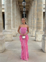 Blonde model wearing the Amelina Strapless Gown in Pink campaign shot