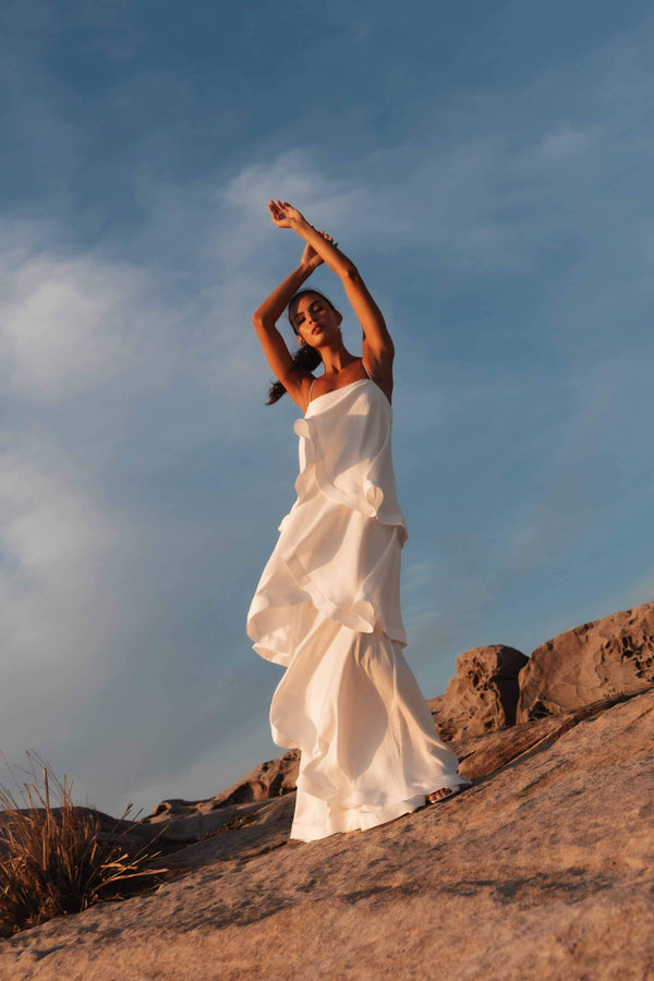 model wearing Tilly Tiered Maxi Dress in White campaign front shot
