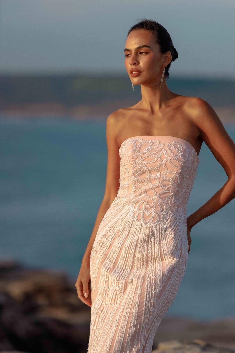Blonde model wearing Kiki Strapless Gown in Pink campaign close up shot