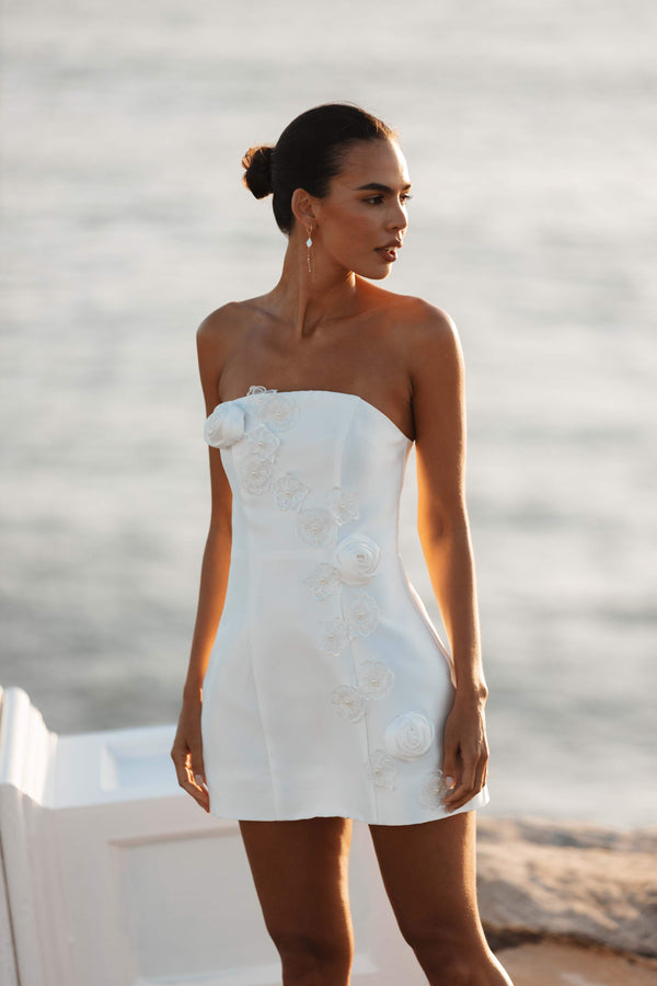 Brunette model wearing Oleander Strapless Maxi Dress In White close up campaign shot
