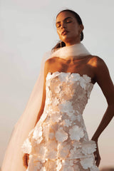 Brunette model wearing Selene Maxi Tiered 3D Dress in White close up campaign shot