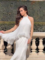 Brunette model wearing the Poppy Cape Gown in White posed campaign shot 