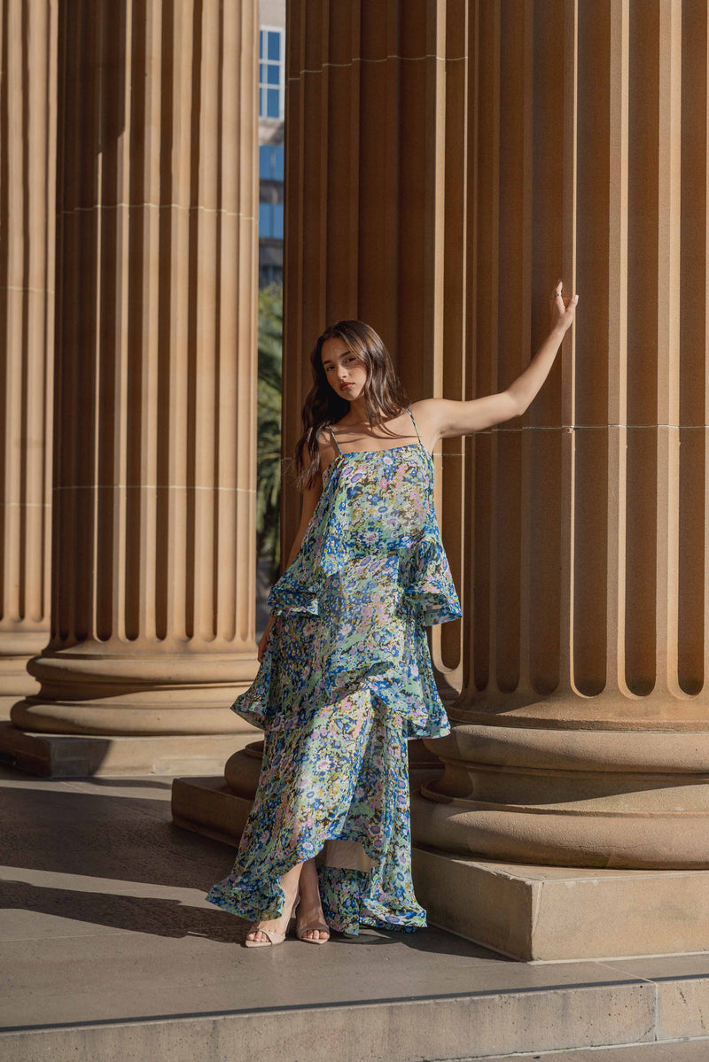 Brunette model wearing the Armani Tiered Maxi Dress In Blue Floral campaign shot