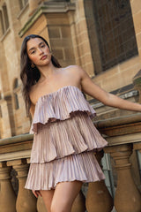 Brunette model wearing Lison Tiered Strapless Mini Dress in Pink campaign close up shot