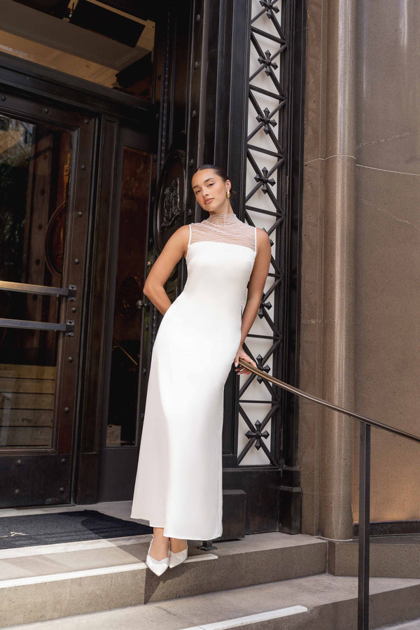 Brunette model wearing Margot Satin Gown in White campaign shot