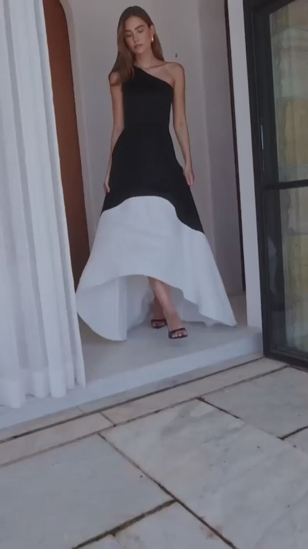 Brunette model wearing Sorrel One Shoulder Gown in Black & White campaign video 