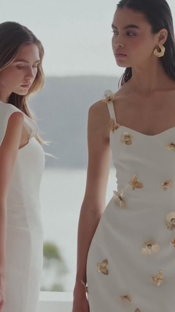 Brunette model wearing Mira Sweetheart Mini Dress in White campaign video 
